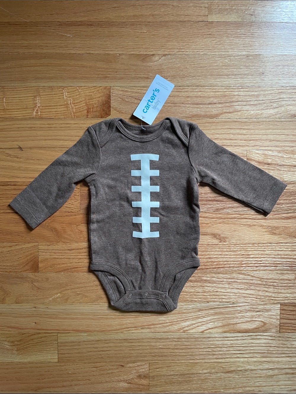 NWT long sleeve football onesie